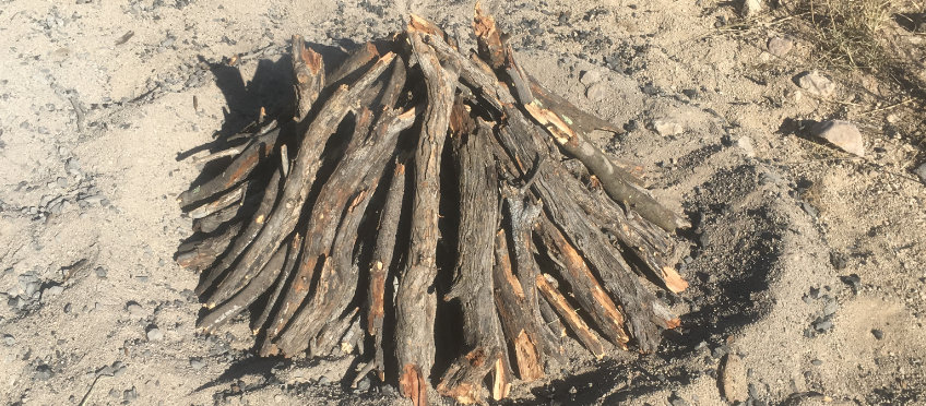 Pottery arranged in a teepee fire structure