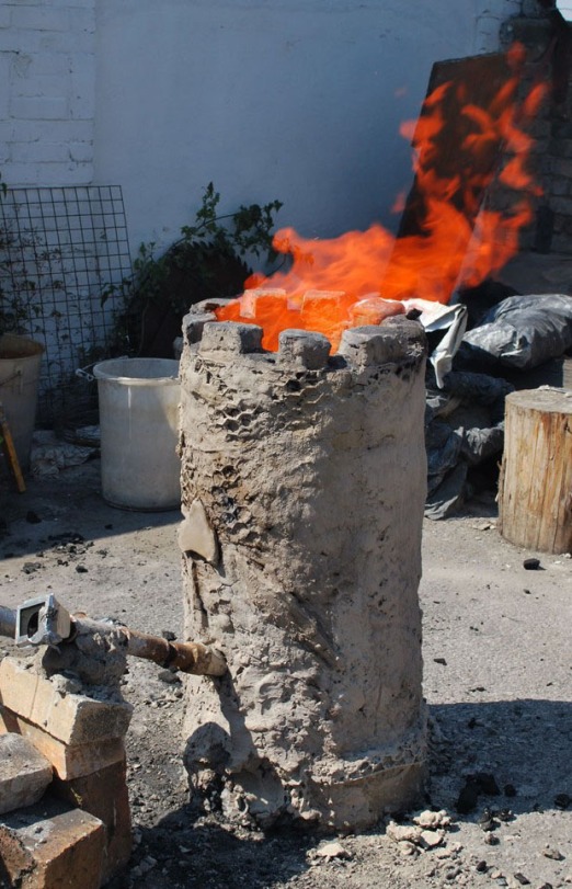 A bloomery furnace in full operation
