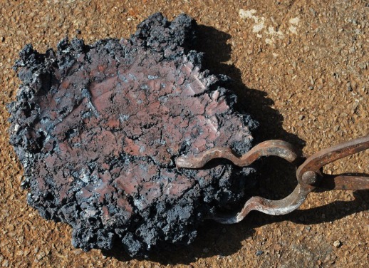 An iron bloom after extraction from the furnace
