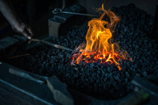 Heating metal in a charcoal forge